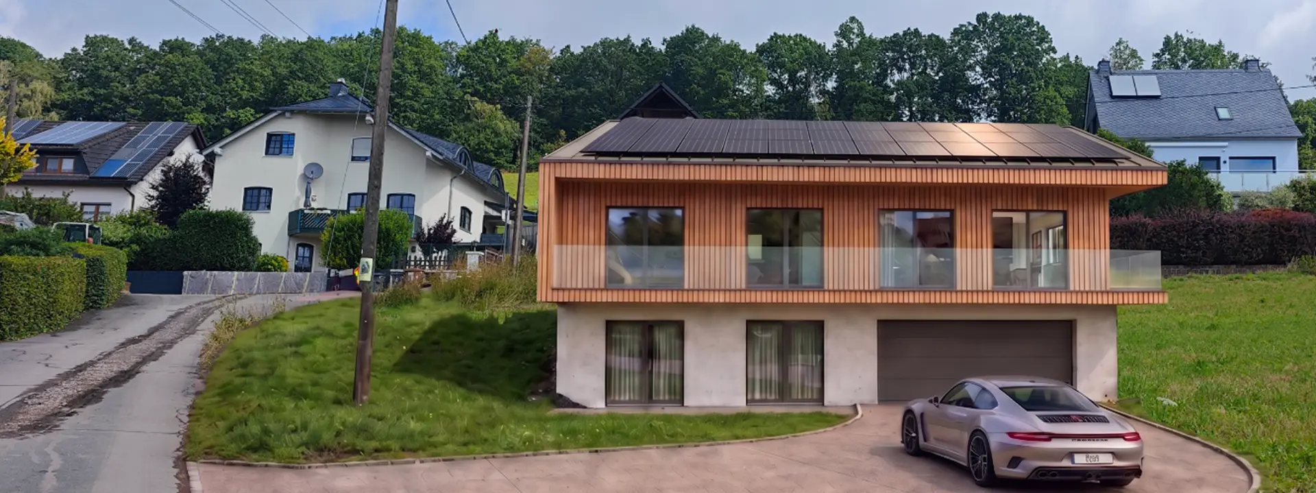 Neubau eines modernen Einfamilienhauses mit Holzfassade und Photovoltaik